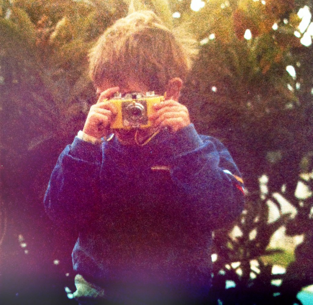 Maciej playing with a toy camera, Córdoba, Spain 1983